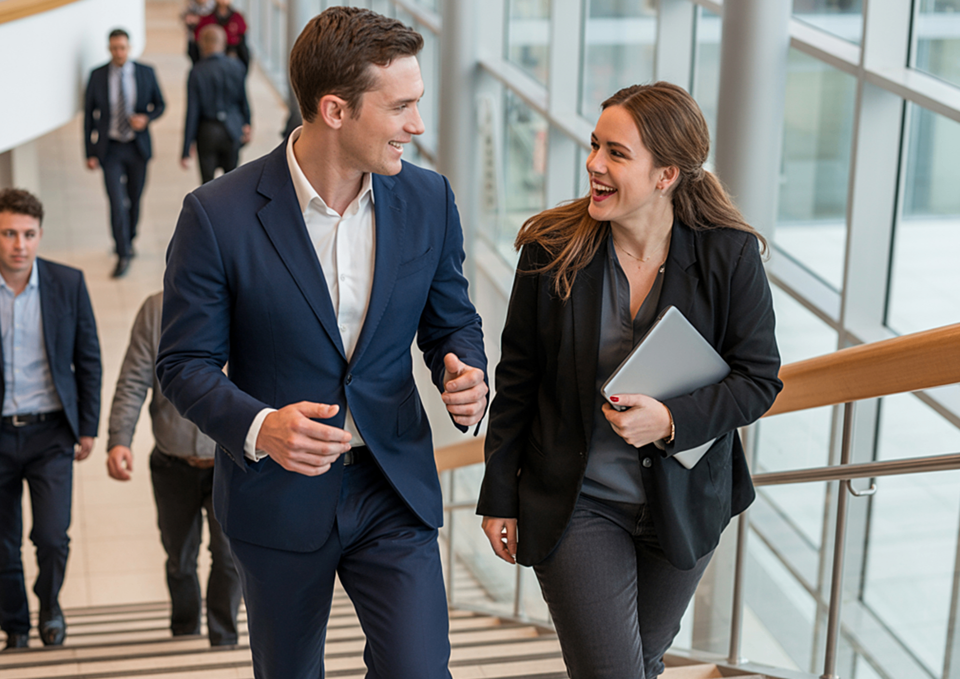 U.S. expat professionals walking up stairs in a Stuttgart office building